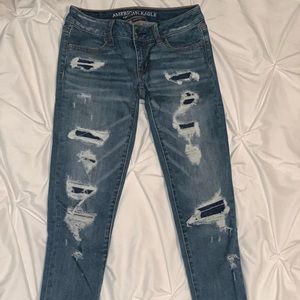 Distressed denim skinny jeans